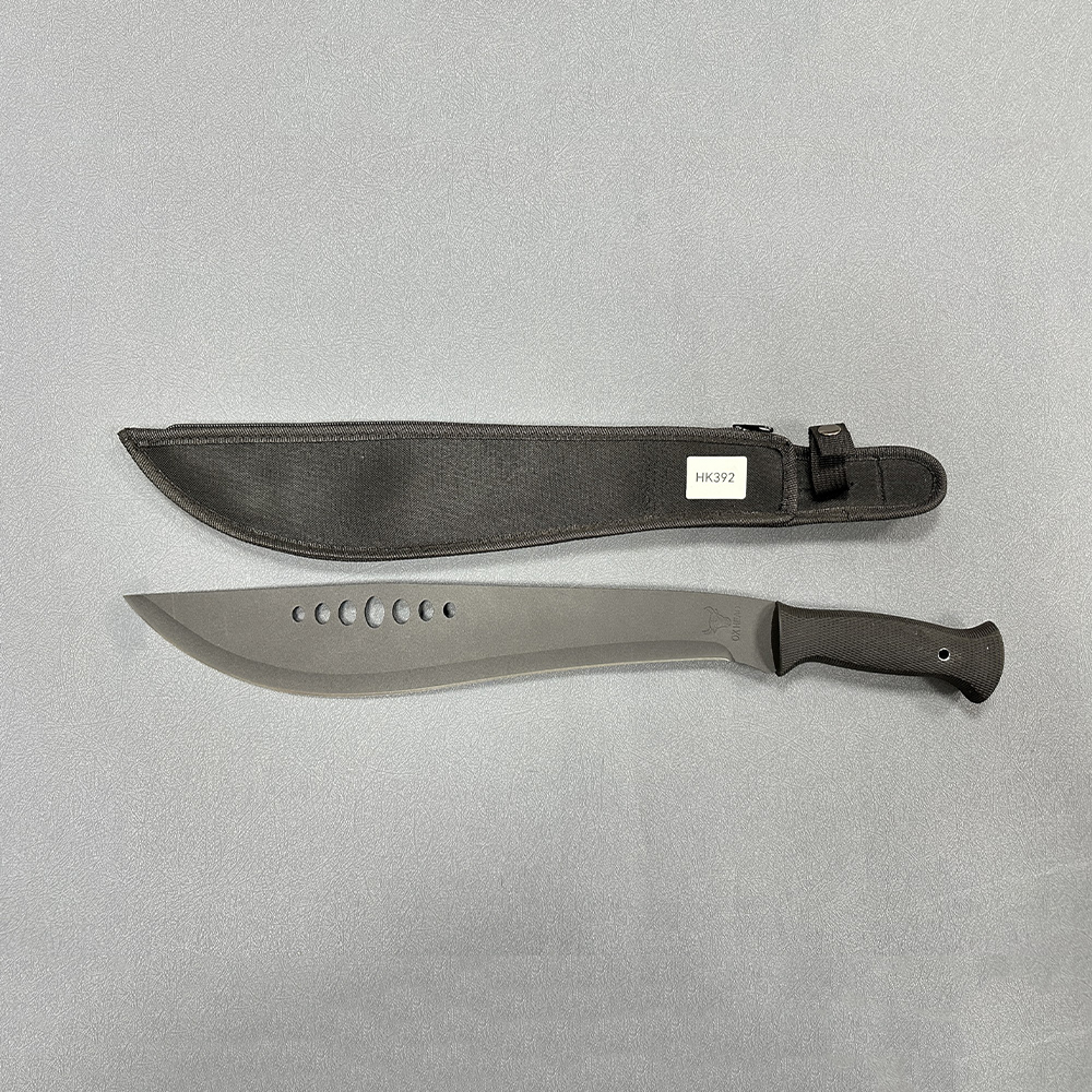 Full tang machete with broad blade featuring circular holes and textured grip, paired with fabric sheath with securing strap