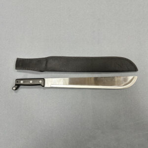 Single-edged machete with curved metal blade and black handle alongside fabric sheath with strap on solid surface